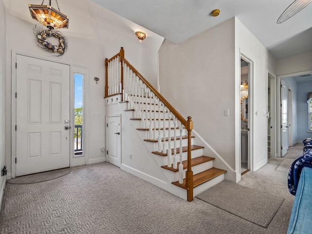 view of carpeted entrance foyer