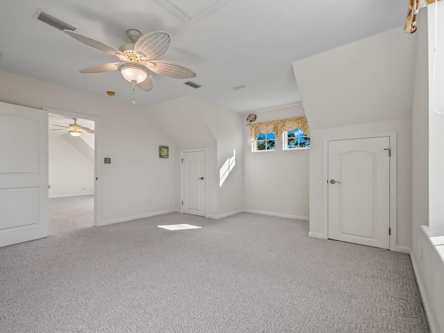 bonus room featuring ceiling fan, light colored carpet, and vaulted ceiling