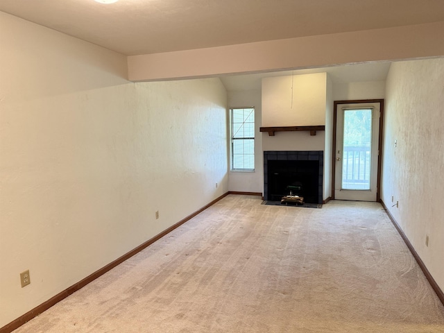 1108 Green Tree Ct Unit 1, Tallahassee, FL 32304 - unfurnished living room featuring light carpet and a fireplace