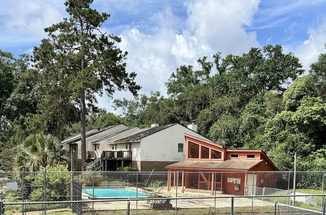 1108 Green Tree Ct Unit 1, Tallahassee, FL 32304 - view of swimming pool featuring a fenced backyard and view of wooded area