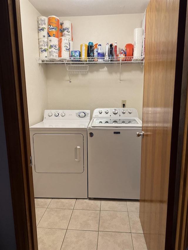 1838 Fernando Ln, Tallahassee, FL 32303 - laundry room featuring washer and dryer and light tile patterned flooring