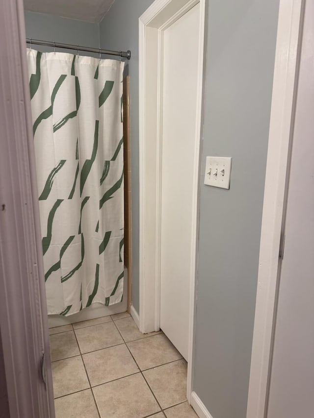 1838 Fernando Ln, Tallahassee, FL 32303 - bathroom with tile patterned floors, a shower with shower curtain, and baseboards