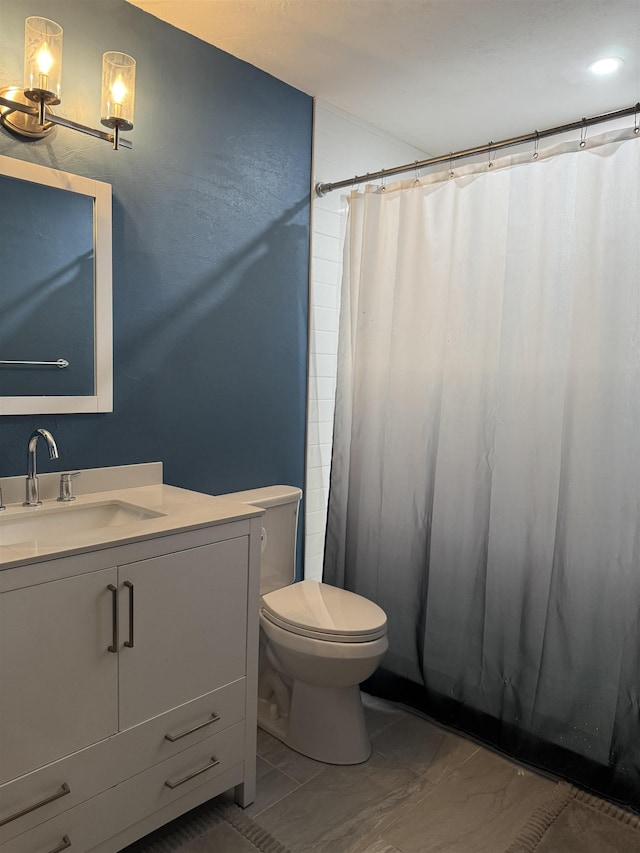 1838 Fernando Ln, Tallahassee, FL 32303 - full bath featuring marble look tile flooring, toilet, vanity, and a shower with curtain