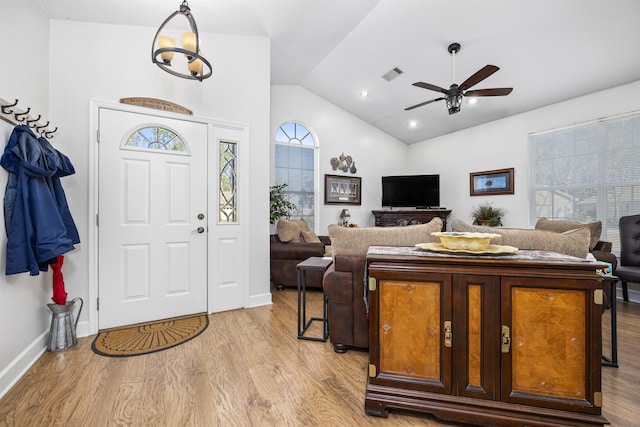 23380 Elmwood Ln, Live Oak, FL 32064 - foyer entrance featuring vaulted ceiling, light wood-style floors, and ceiling fan