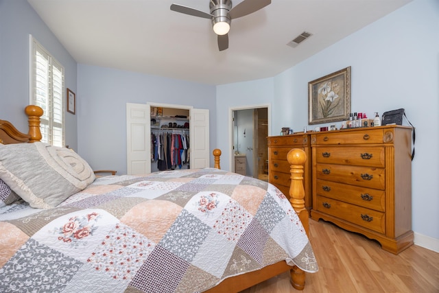 23380 Elmwood Ln, Live Oak, FL 32064 - bedroom with light wood-style flooring, a closet, a spacious closet, and a ceiling fan