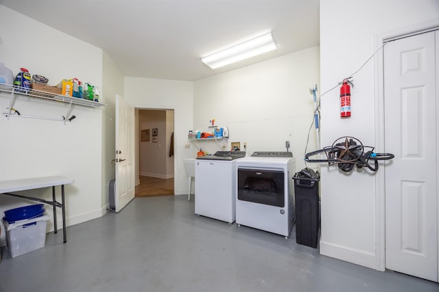 23380 Elmwood Ln, Live Oak, FL 32064 - laundry area featuring washer and clothes dryer and baseboards