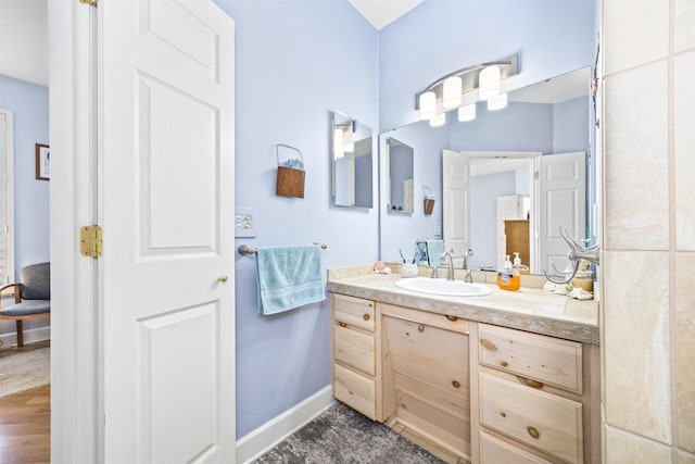 23380 Elmwood Ln, Live Oak, FL 32064 - bathroom featuring vanity and baseboards