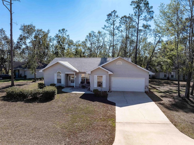 23380 Elmwood Ln, Live Oak, FL 32064 - single story home with an attached garage and driveway