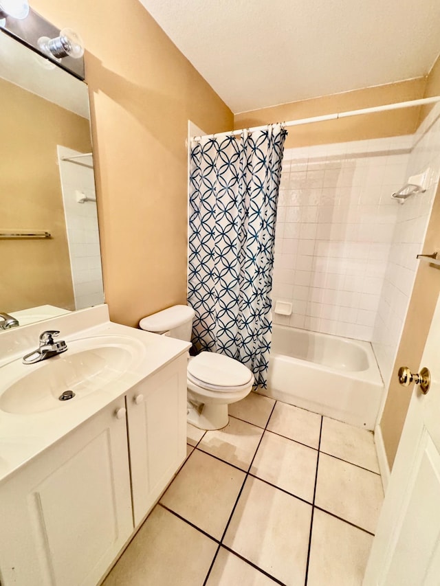 full bathroom with toilet, shower / bath combo, vanity, and tile patterned floors