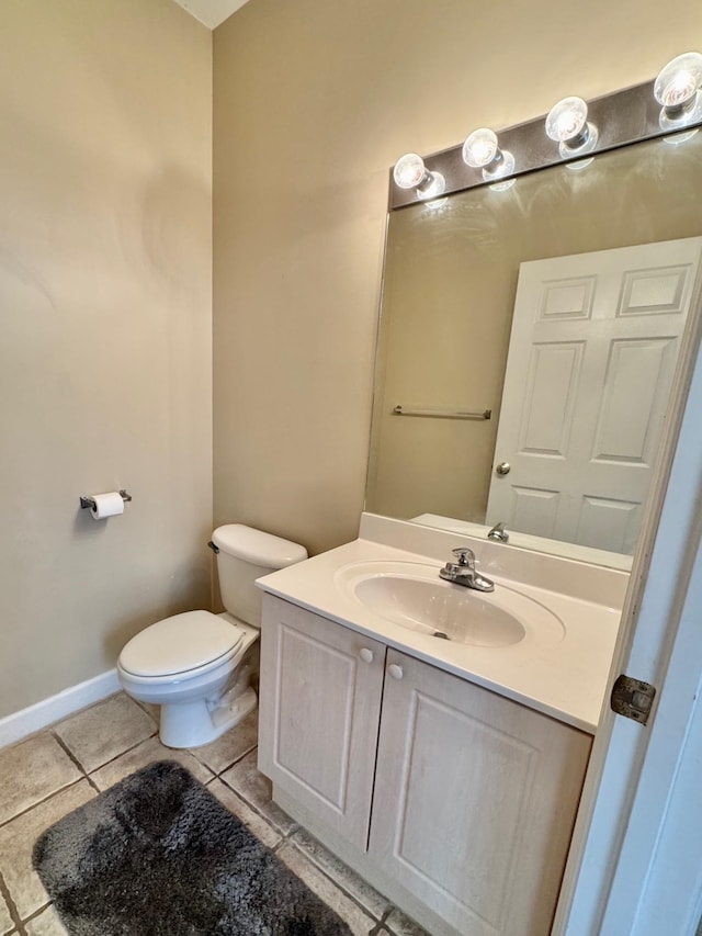 bathroom with tile patterned floors, vanity, and toilet