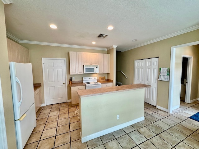 kitchen featuring light tile patterned floors, white appliances, a textured ceiling, and ornamental molding