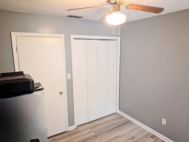 3137 Huttersfield Cir, Tallahassee, FL 32303 - unfurnished bedroom featuring light wood-style floors, a ceiling fan, and a closet