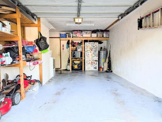 3137 Huttersfield Cir, Tallahassee, FL 32303 - garage with a garage door opener, freestanding refrigerator, and water heater
