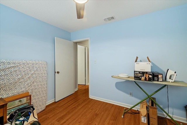 office space featuring hardwood / wood-style flooring and ceiling fan