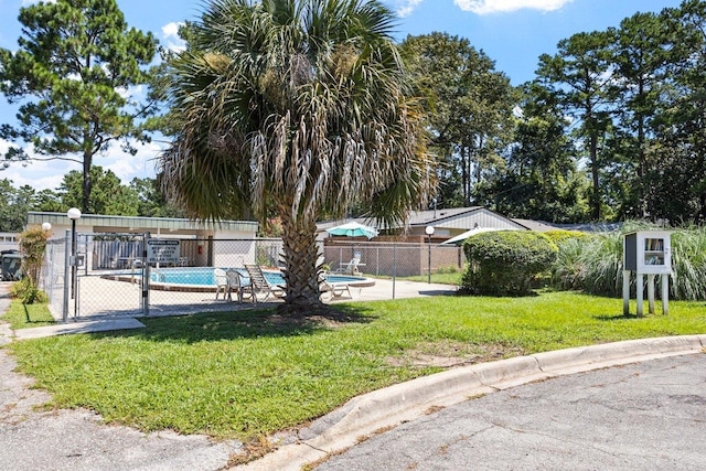 exterior space with a fenced in pool