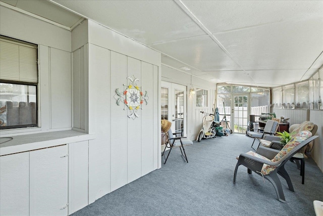 sunroom featuring vaulted ceiling