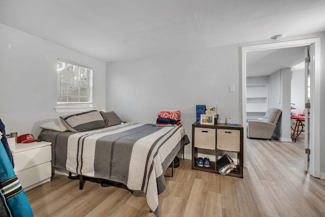 bedroom with light wood-style floors