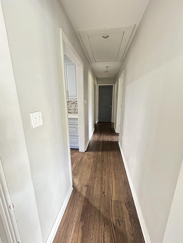 2111 Gibbs Dr, Tallahassee, FL 32303 - corridor featuring attic access and dark wood-style floors
