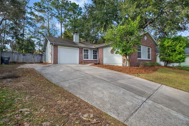 ranch-style house with a front yard and a garage