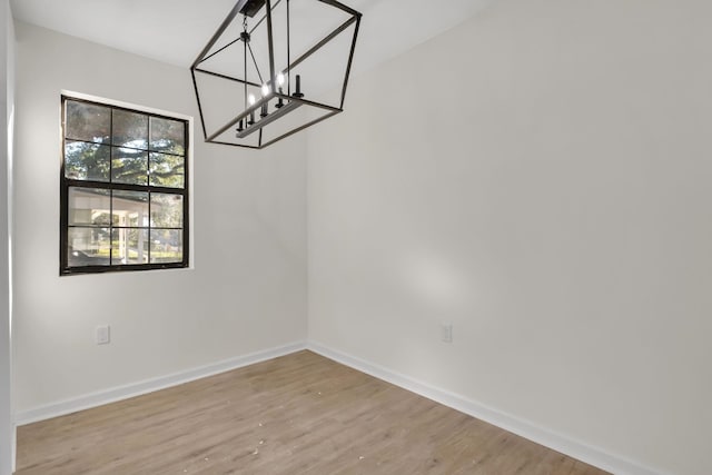 1115 Joe Louis St, Tallahassee, FL 32304 - unfurnished dining area featuring a chandelier and wood finished floors