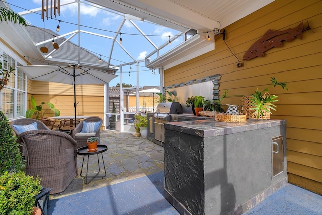 view of patio / terrace with exterior bar, a lanai, and an outdoor kitchen