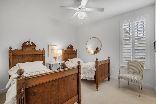 bedroom featuring light carpet and ceiling fan