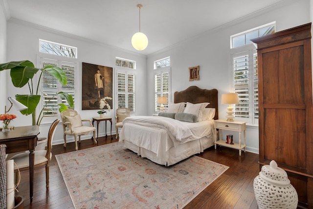 bedroom featuring ornamental molding and dark hardwood / wood-style floors