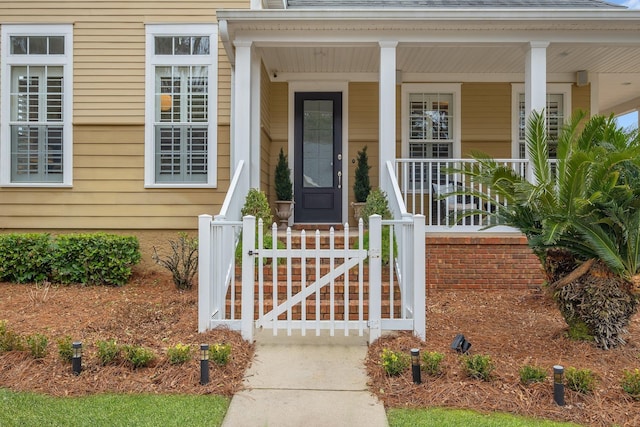 doorway to property featuring a porch