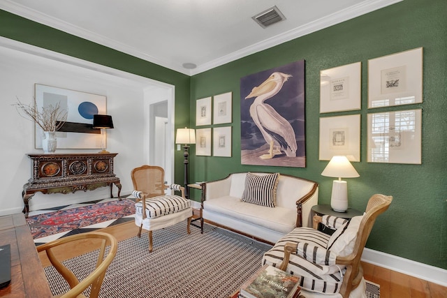 living area with ornamental molding and wood-type flooring