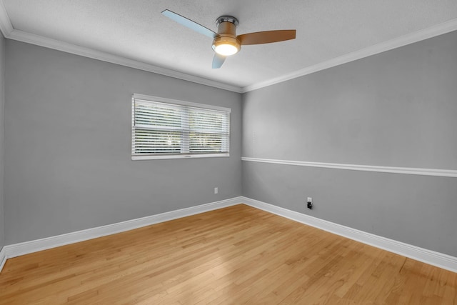 spare room with a textured ceiling, light hardwood / wood-style flooring, ceiling fan, and ornamental molding