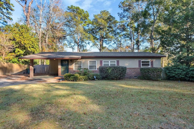 ranch-style house with a front yard and a carport