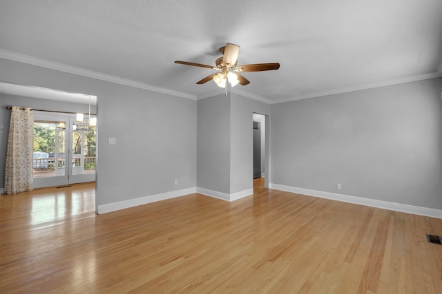 empty room featuring light hardwood / wood-style floors, ceiling fan, and crown molding