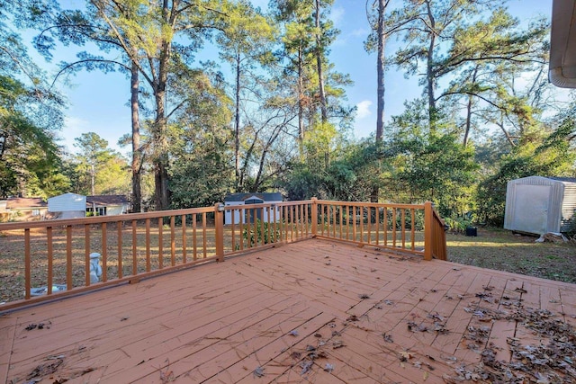 wooden terrace featuring a storage unit