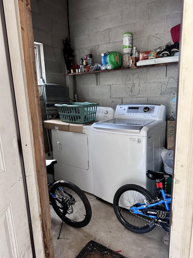 clothes washing area featuring washer and dryer