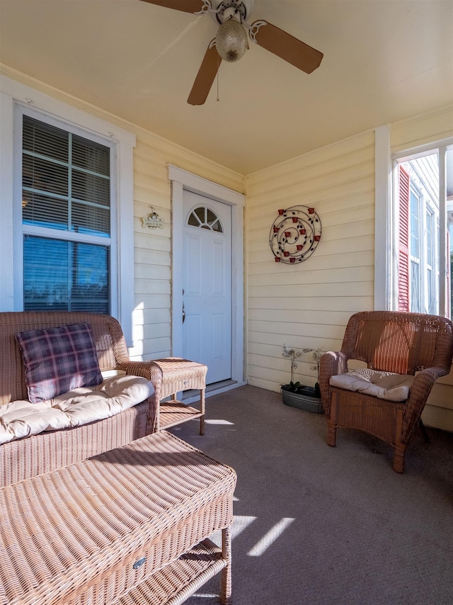 exterior space featuring ceiling fan