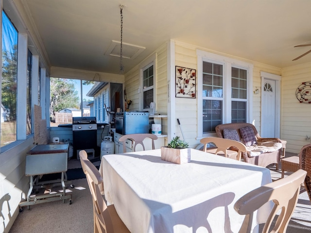 view of patio with area for grilling, ceiling fan, and an outdoor living space