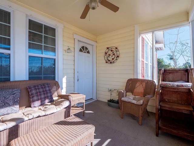 exterior space featuring ceiling fan and an outdoor living space