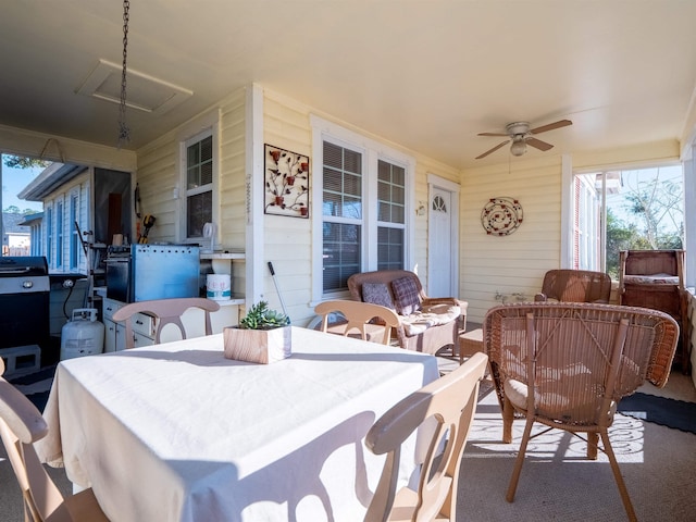 view of patio featuring area for grilling, ceiling fan, and an outdoor living space