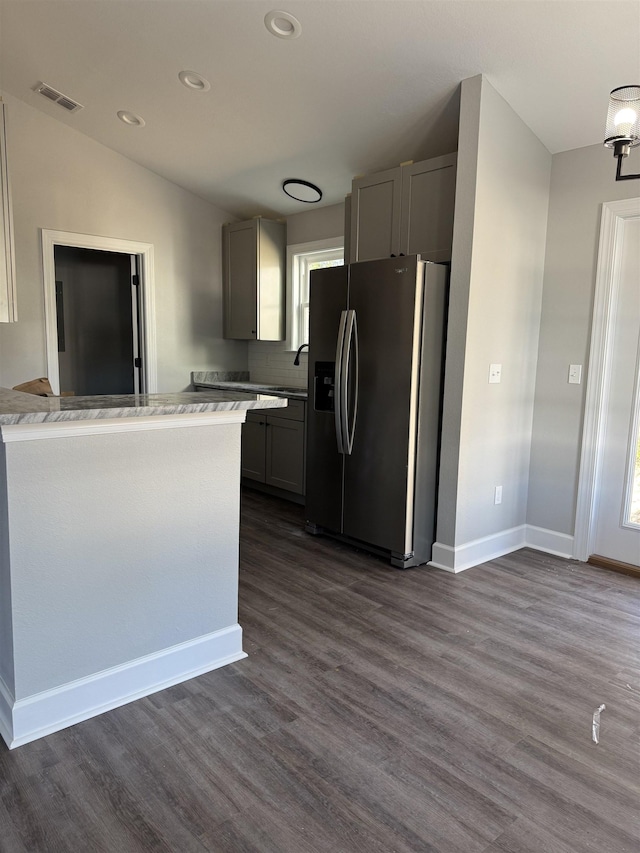 1125 E Dogwood St, Monticello, FL 32344 - kitchen with stainless steel refrigerator with ice dispenser, dark wood finished floors, light countertops, gray cabinets, and recessed lighting