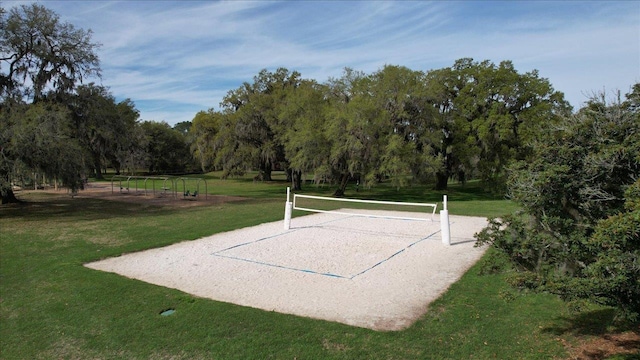 view of home's community with a yard and volleyball court