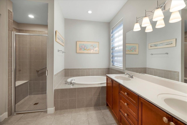 bathroom with tile patterned floors, plus walk in shower, and vanity