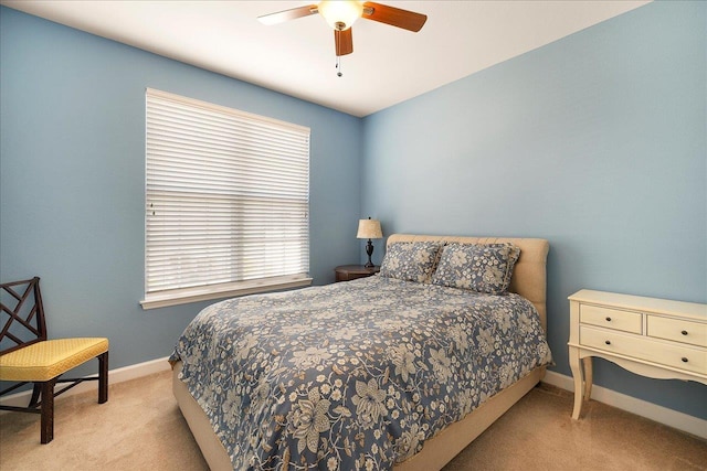 bedroom featuring ceiling fan and light colored carpet