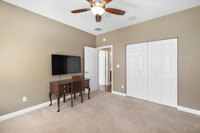 office with light carpet, ceiling fan, baseboards, and visible vents