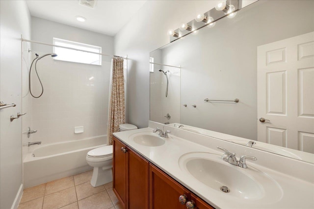 full bathroom featuring shower / bathtub combination with curtain, vanity, toilet, and tile patterned floors