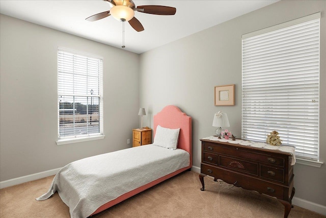 carpeted bedroom with ceiling fan