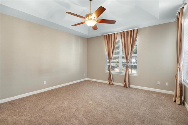 empty room with ceiling fan and light colored carpet