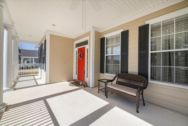 view of patio / terrace with ceiling fan and a porch