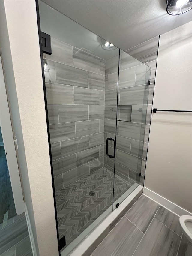 71 Chickat Trl, Crawfordville, FL 32327 - bathroom featuring a shower stall and baseboards