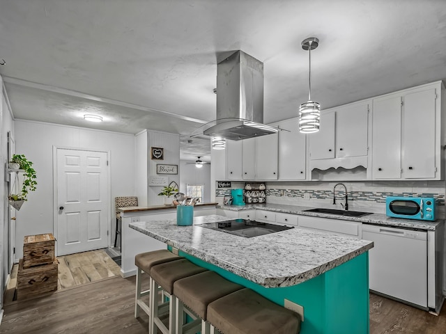 kitchen with a sink, island exhaust hood, white dishwasher, black electric cooktop, and dark wood-style flooring