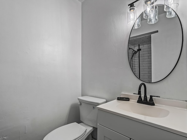 bathroom with toilet and vanity